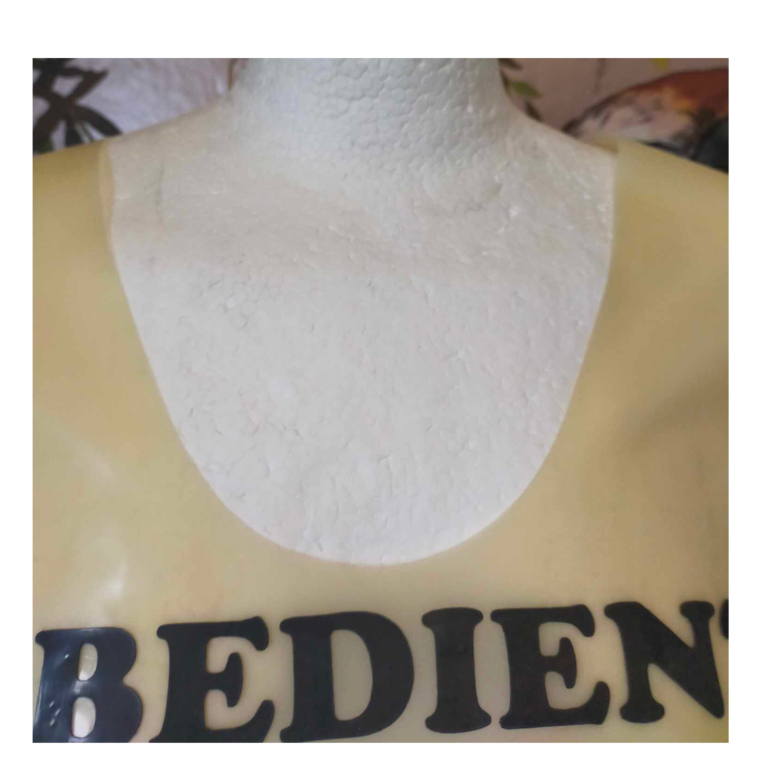 A scoop neck translucent natural latex t shirt with black custom text appliques.