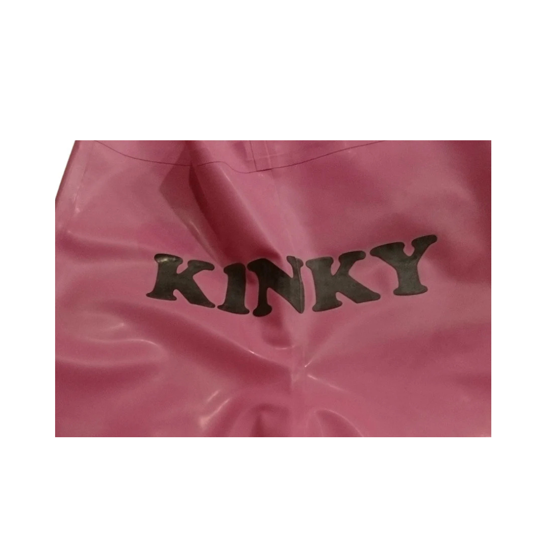 A pair of bubble gum pink latex board shorts with black text detail on the back.
