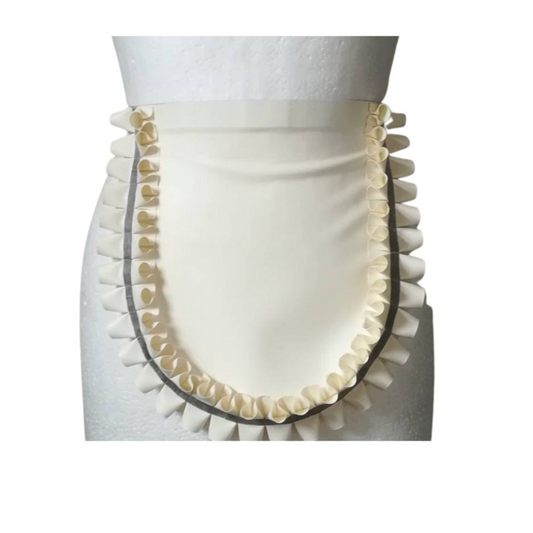 A white latex double frill apron with black trim.