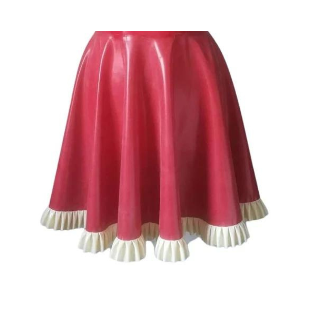 Close up of a red latex dress with frill hem in classic white.