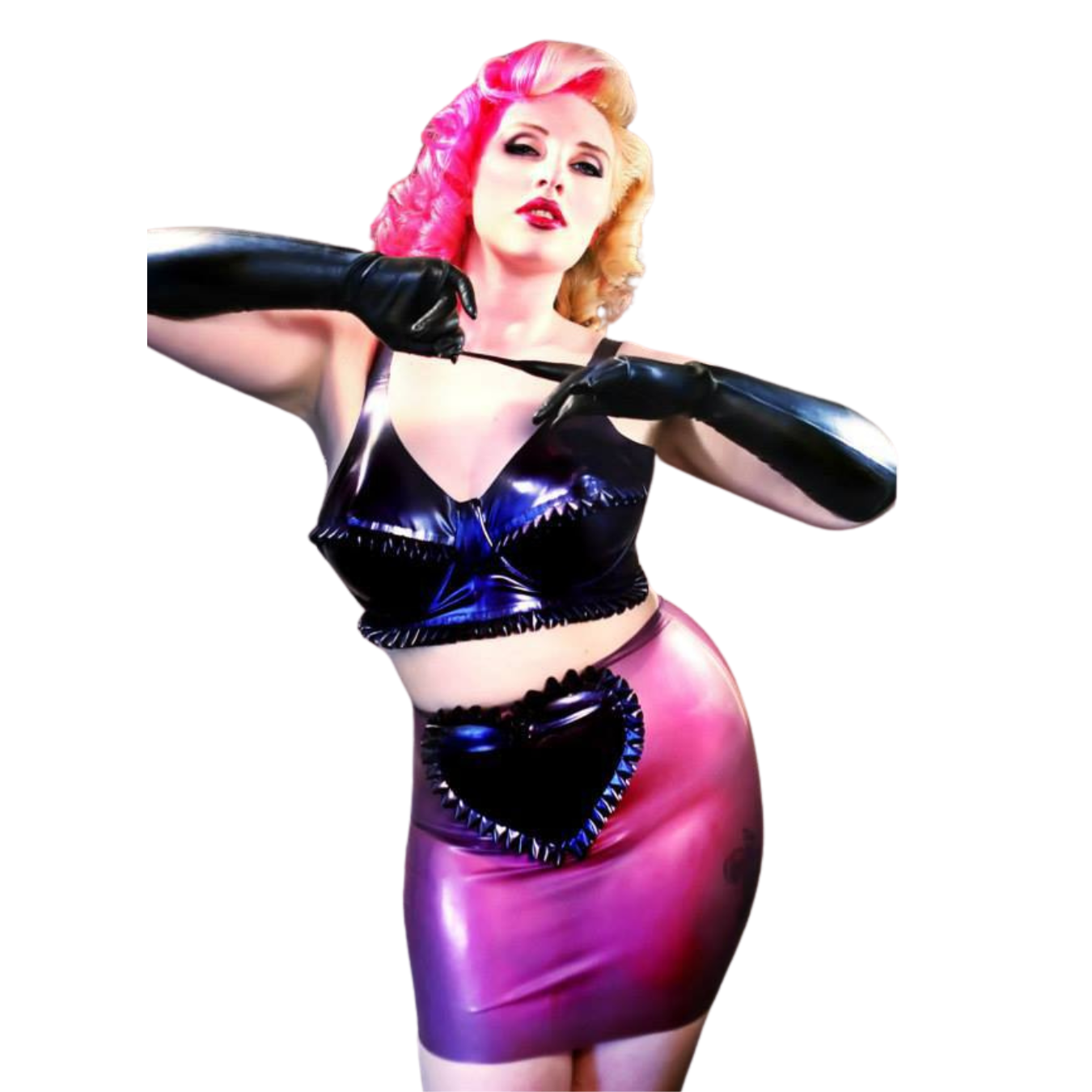 A translucent lilac latex mini skirt with large heart applique. The heart is surrounded by matching frilled trim edging.