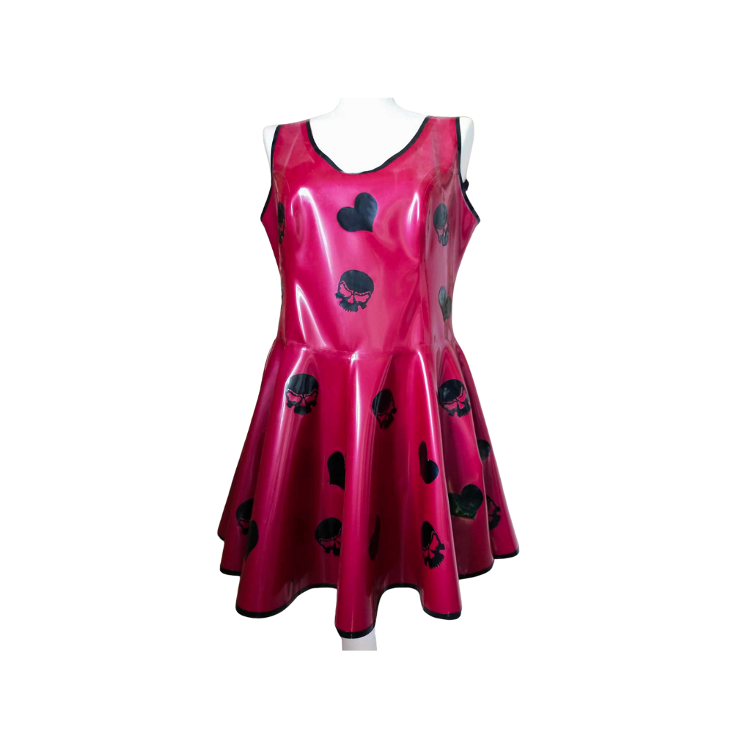 A metallic red latex sleeveless skater dress with black trim around the neck and hemline. The dress features black hearts and skull appliques.