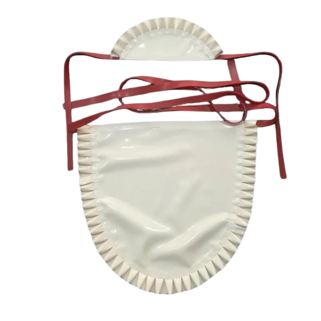 A white latex apron and cap with frilled edging and red tie fastening.