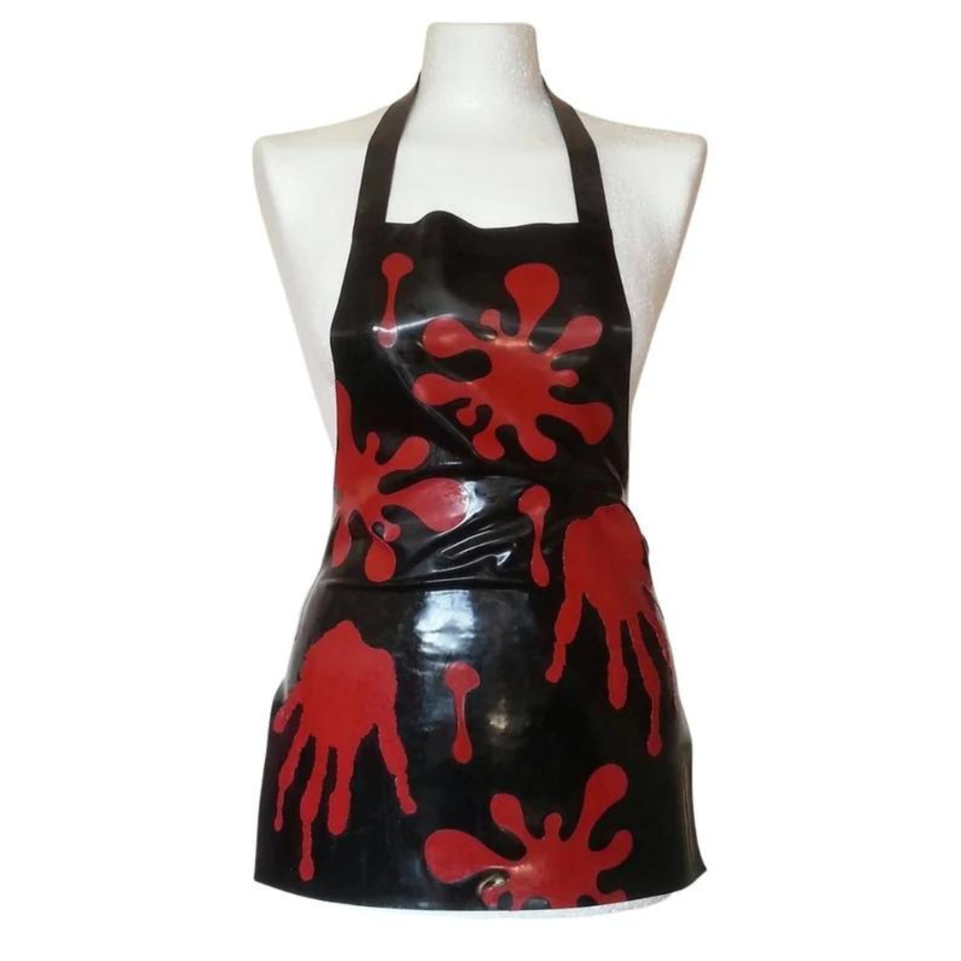 A black latex apron with red hand print appliques.