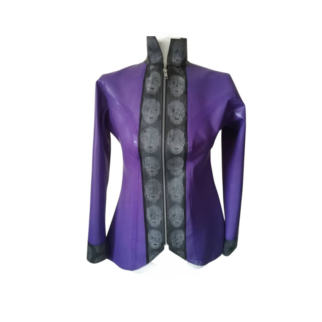 A purple latex jacket with silver coloured zip opening. The collar is a mandarin style . The front of the jacket and cuffs feature embossed skull latex panels.