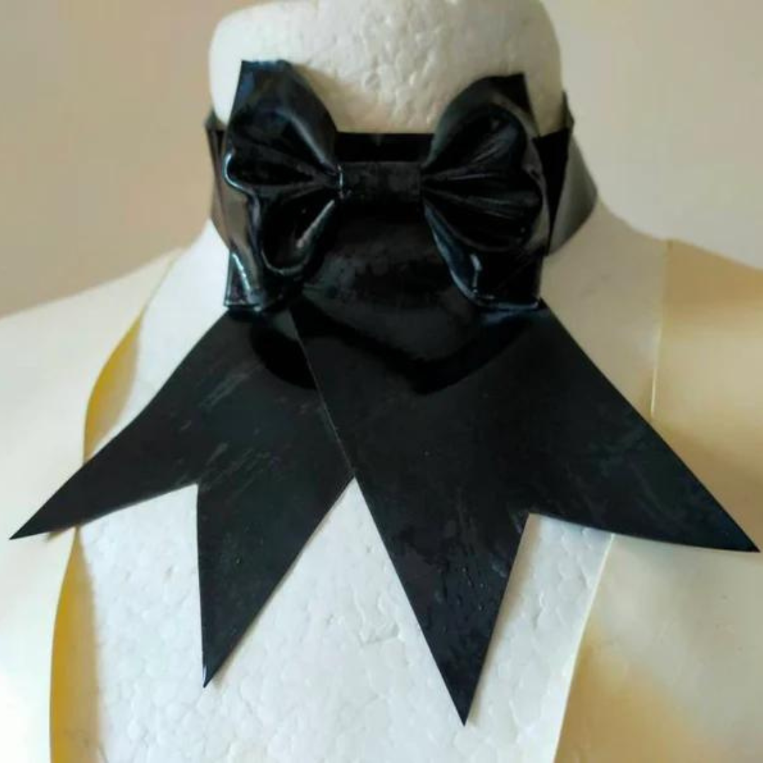 A black latex western bow choker with press stud fastening on the back.