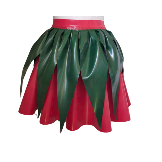 A latex mini skirt with metallic green leaves detail over a red base colour latex skirt.