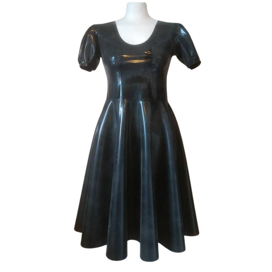 A scoop neck puff sleeve latex dress. The black dress is a fit and flare style.