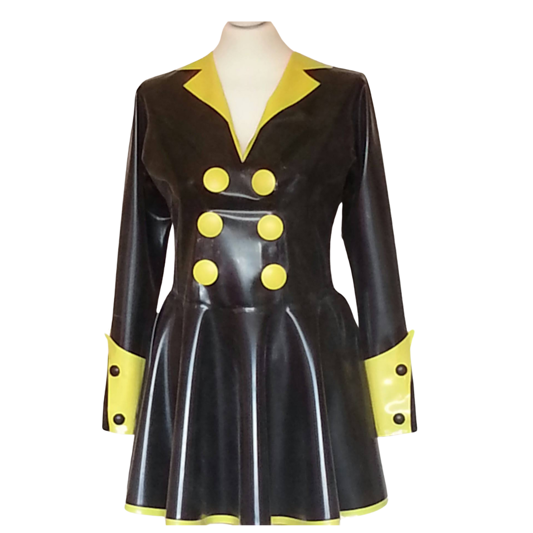 A black latex long sleeved swing dress with a yellow collar. The cuffs have turn ups with black buttons.