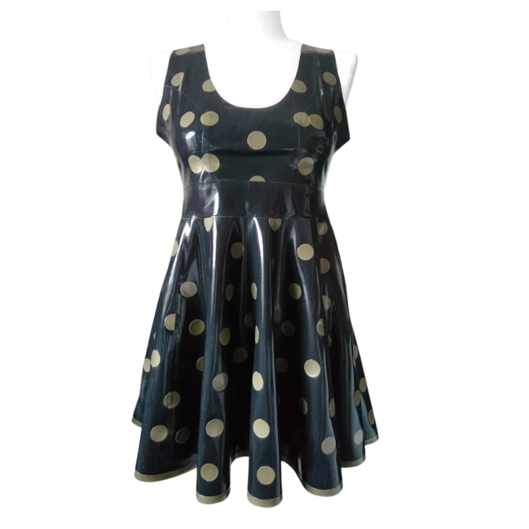 A black sleeveless fit and flare dress with gold polka dots. It has a matching gold trim on the hemline.