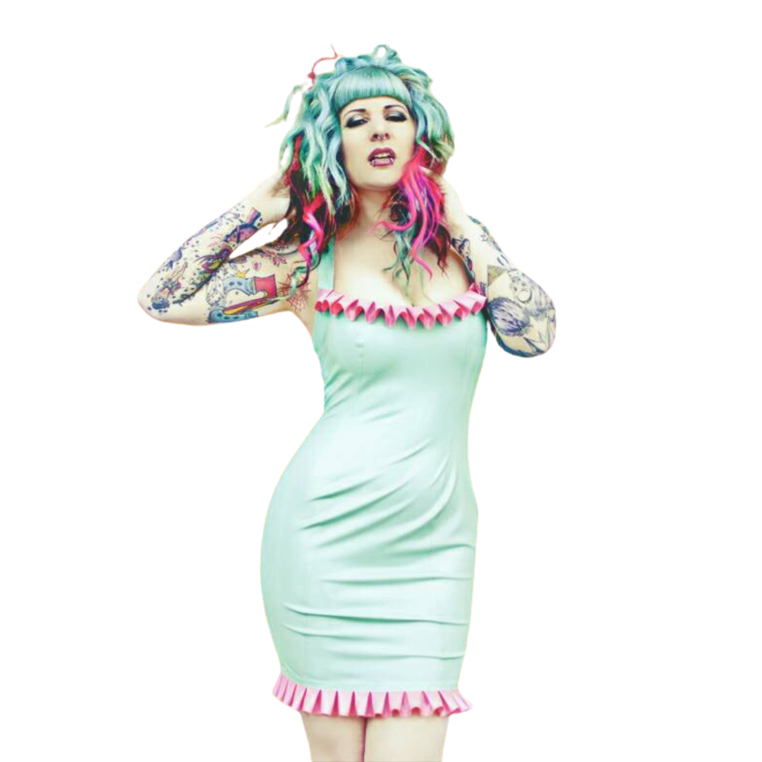 A jade green sleeveless latex dress adorned with bubble gum pink frills around the hemline and bust line.