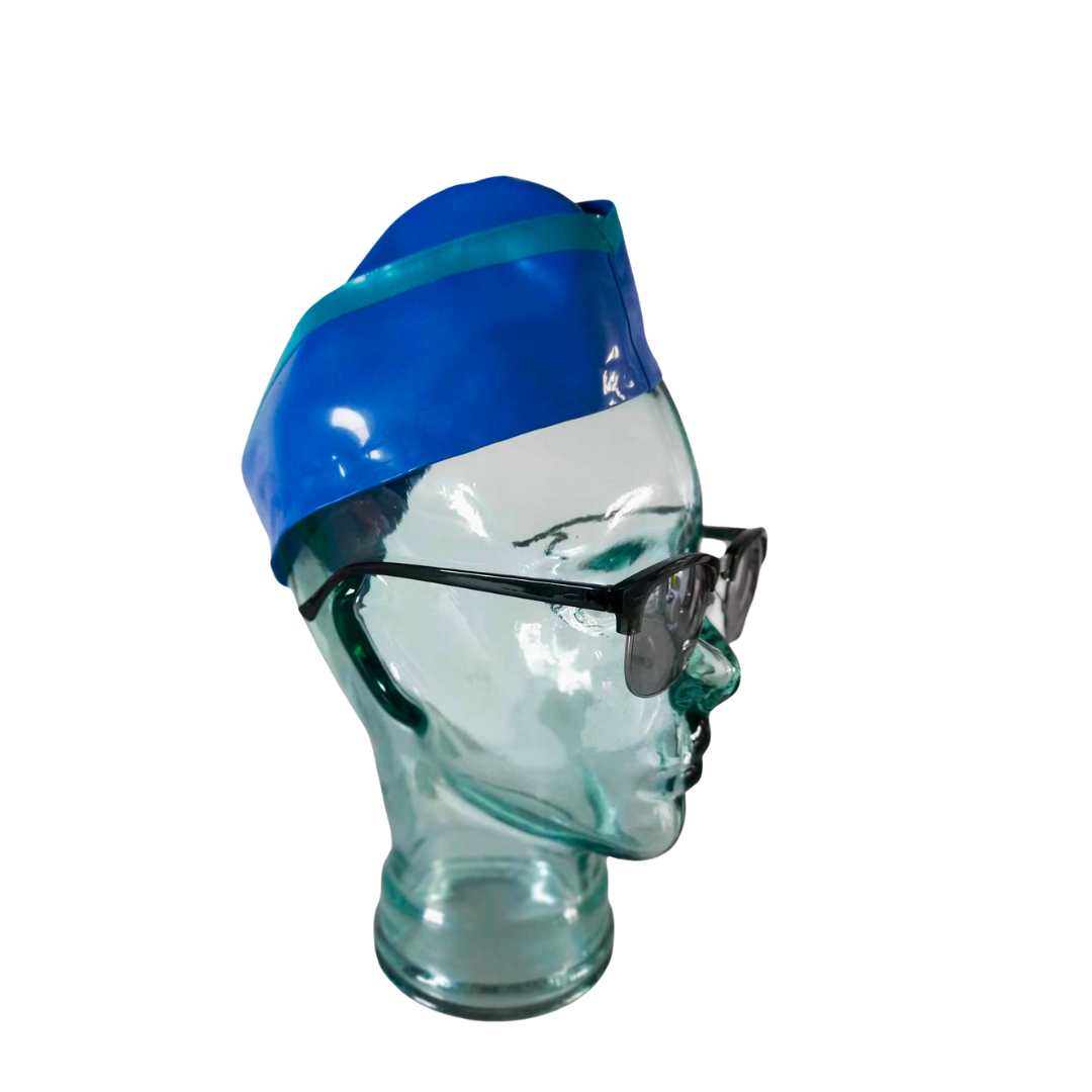 A mid blue latex airline side cap with aqua trim detail.