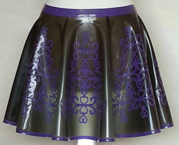 A translucent black skater skirt with purple baroque style pattern and trim detail.
