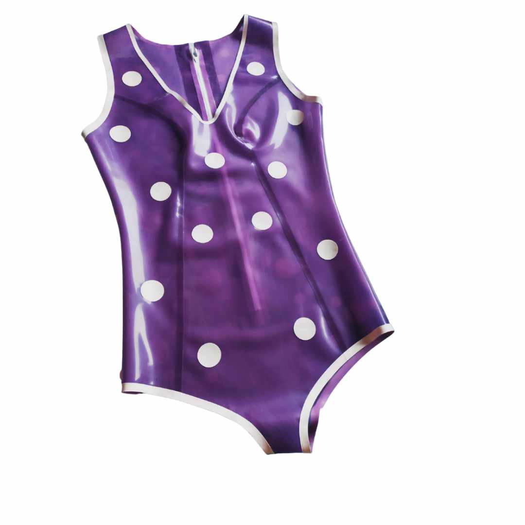 A purple latex playsuit with white trim and white polka dot appliques.