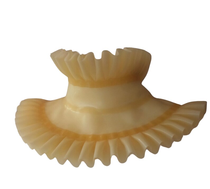 A translucent natural frilled latex choker with frill trim.