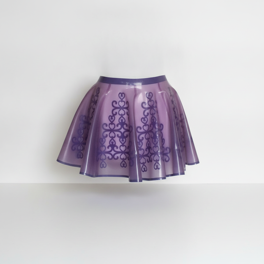 A purple pleated translucent skirt with a darker purple ornate scroll pattern and a solid purple waistband, shown against a plain white background.