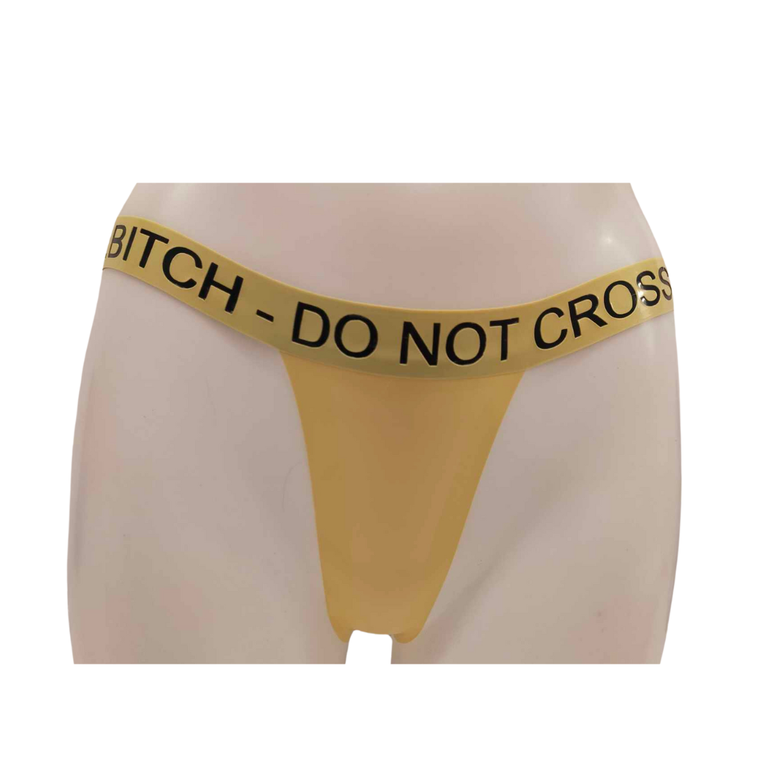 A yellow latex thong with black custom text detailing on the waistband.