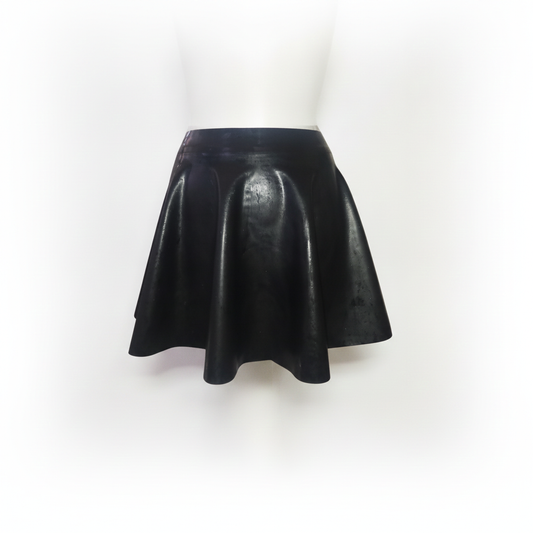A black heavy rubber mini skirt displayed on a white mannequin torso against a white background.