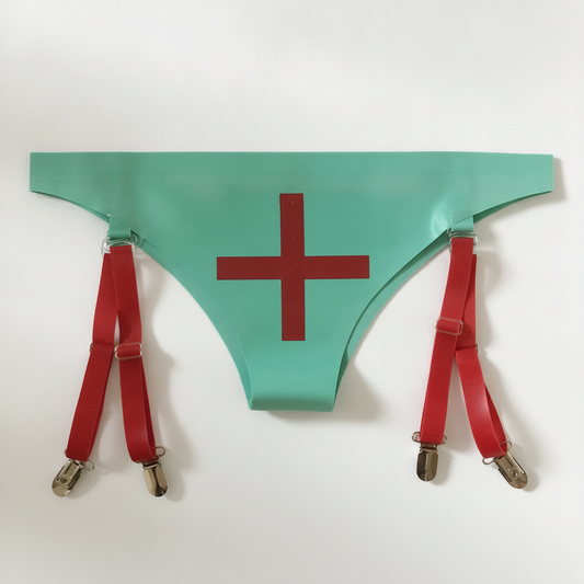 A mint green thong-style garment with a large red cross printed on the front, attached to two red suspender straps with silver metal clips, laid flat on a white background.