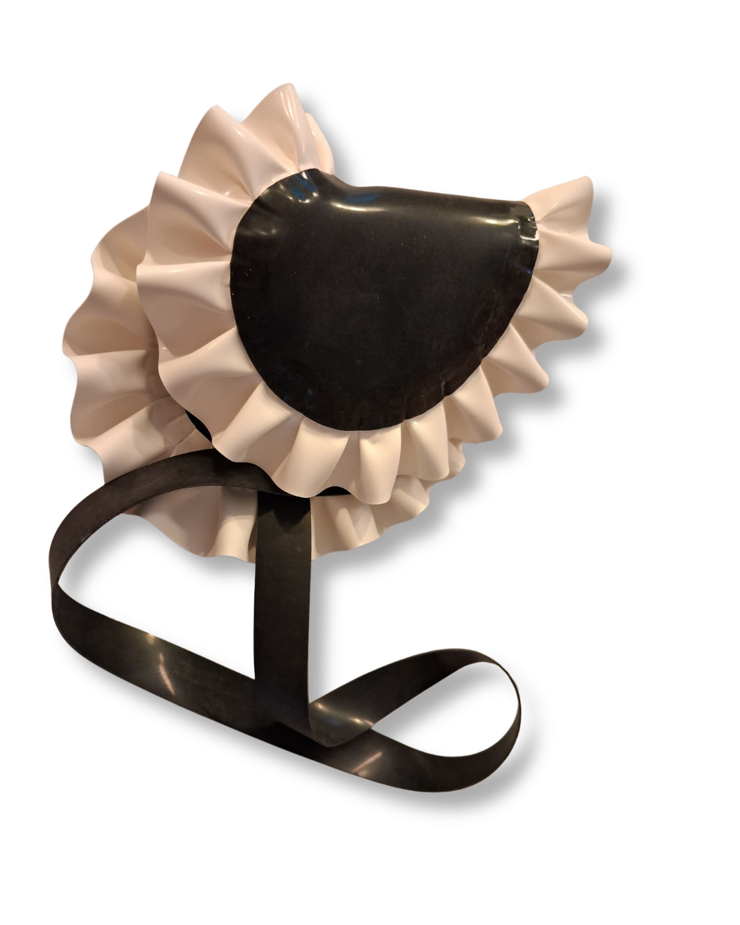 A black latex eye mask with white ruffles on a white background.