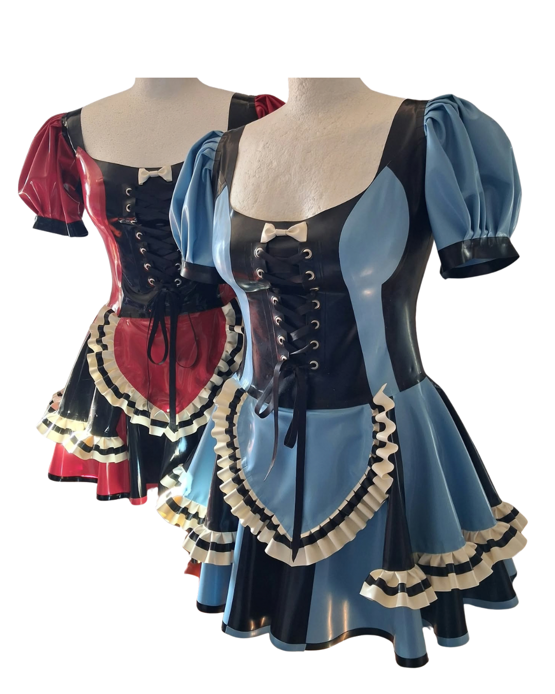 Two short corset-style dresses displayed on mannequins against a plain white background. The front dress is light blue with black panels, cream ruffles, and black trim.