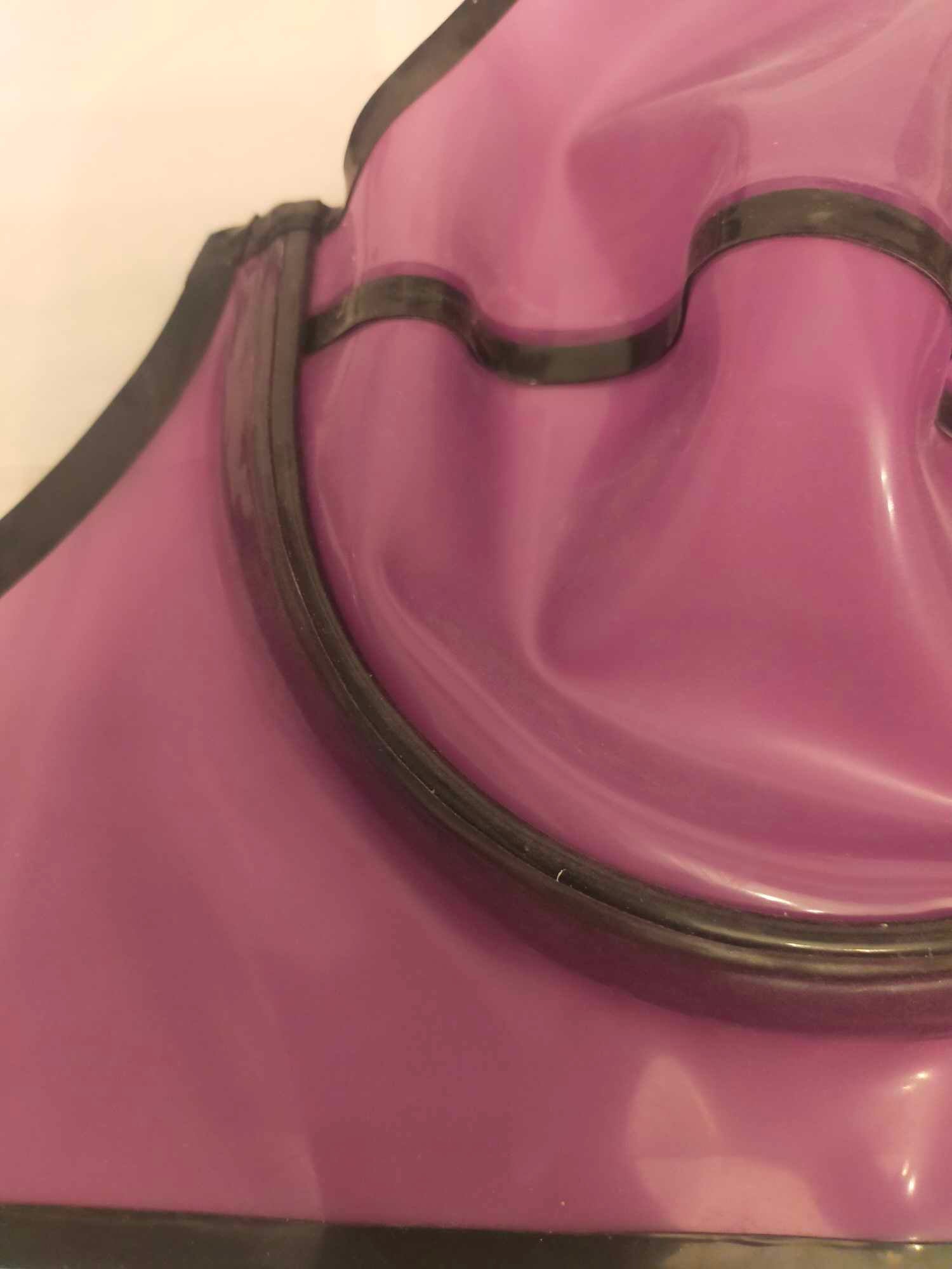 Translucent lilac latex underwired bra cup with black detail.