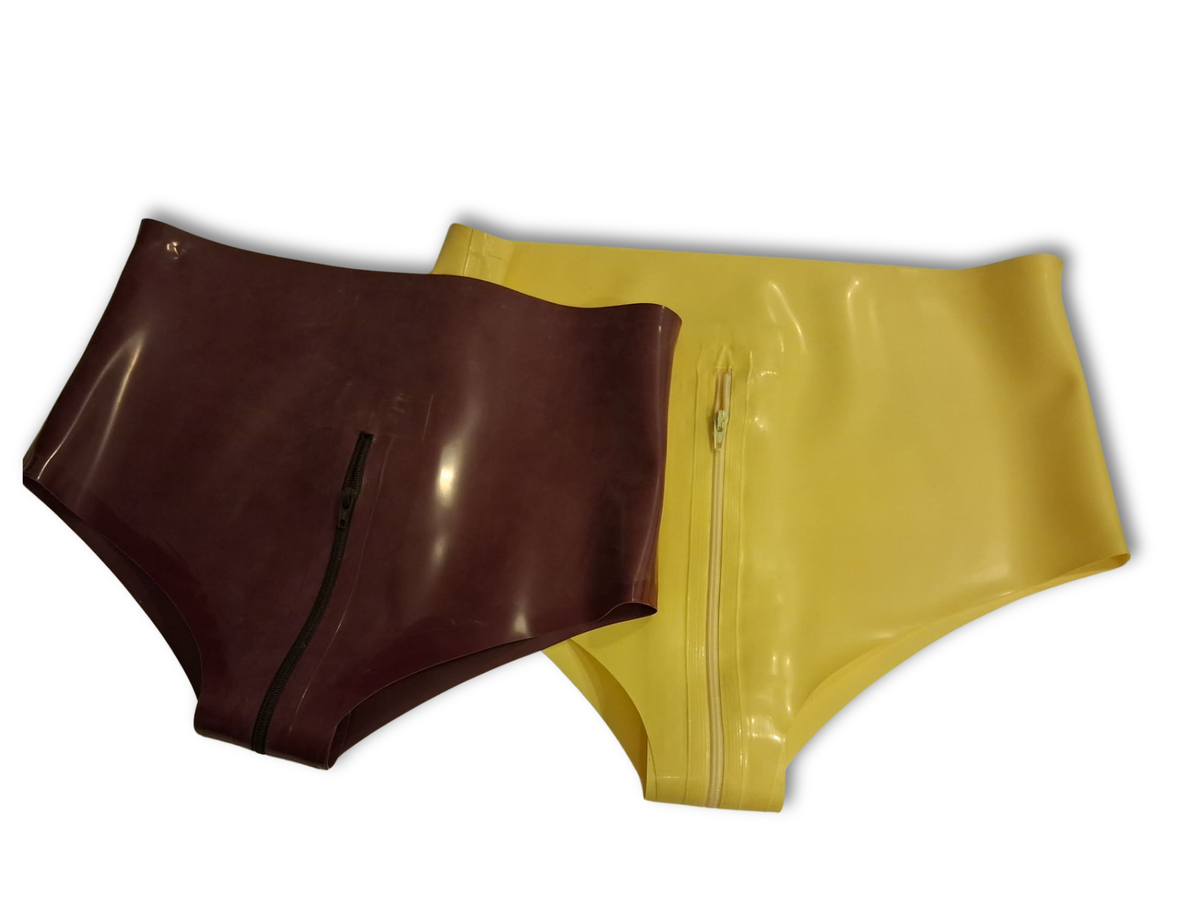 Two high-waisted, shiny latex briefs shown overlapping on a white background. The front pair is plum coloured with a black zipper, and the back pair is mustard yellow with a yellow zipper.